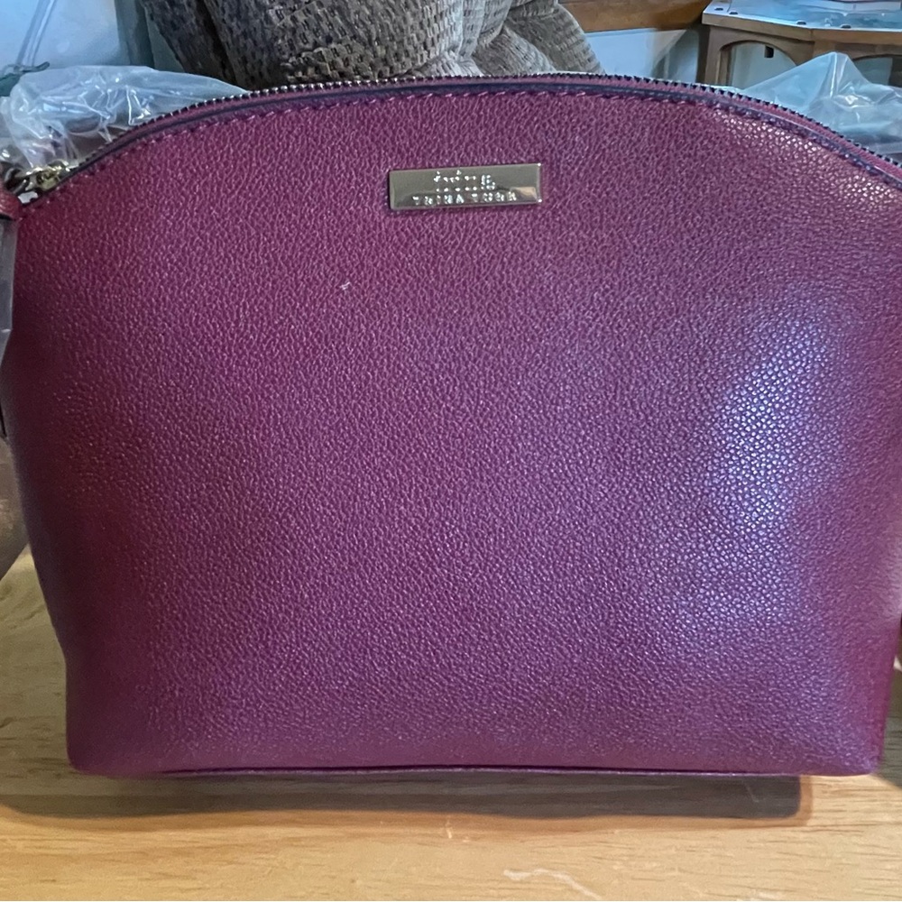 Trina Turk Burgundy crossbody bag.